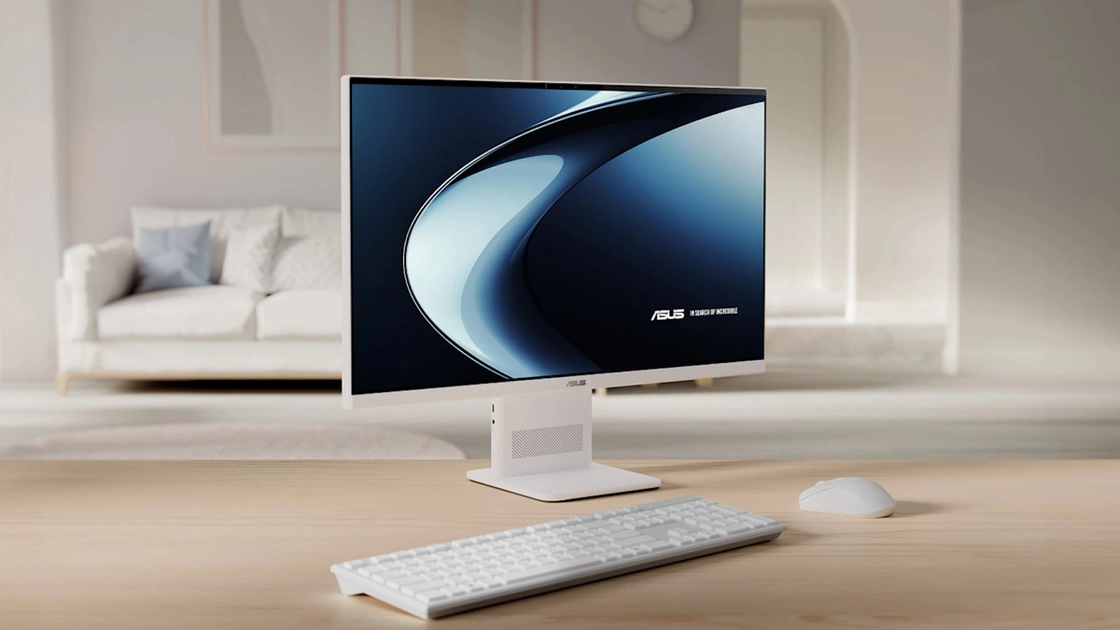 El ASUS VM441 en blanco mate, con teclado y ratón inalámbricos incluidos en la caja.